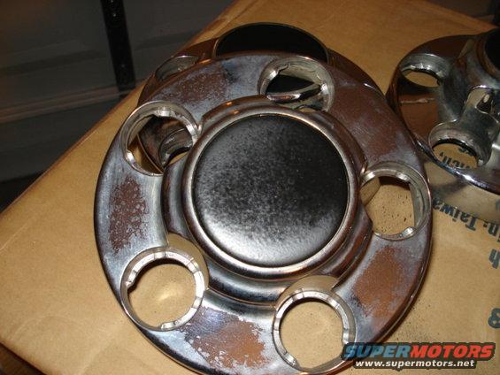 Chrome hubcaps with visible rust and pitting
