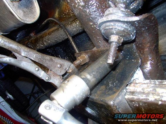 With parts weeks away I used the vice grips to keep the clamp and rubber located in the center, then torqued the heck out of the nuts.