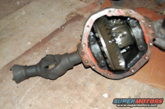 Differential housing with internal gears and driveshaft yoke