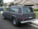 1977 Jeep Cherokee - 1977 Jeep Cherokee with 'FOR SALE' sign in the rear window, parked on a residential street.