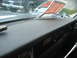 1977 Jeep Cherokee - A 'For Sale' sign is displayed on the windshield of a Jeep, with another Jeep visible in the background.
