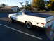 1973 Ford Ranchero - This 1973 Ford Ranchero is captured from a rear three-quarter view, highlighting its white body and black bed cover.