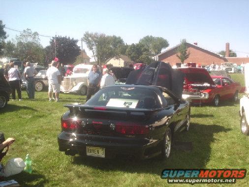 Black Pontiac Firebird with a spoiler and a "RAVEN 3" license plate