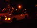 1999 Ford Crown Victoria - A white 1999 Ford Crown Victoria is seen from a 3q-front angle at night.