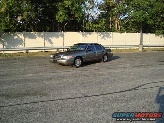 2004 Ford Crown Victoria sedan parked on asphalt lot