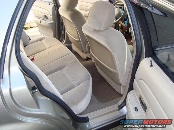 2004 Ford Crown Victoria interior showing tan cloth seats and door panels