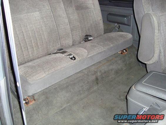 Interior rear bench seat with seatbelts