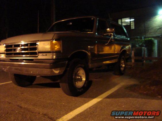 1991 Ford Bronco parked at night