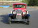 1931 Ford Model A - This red 1931 Ford Model A pickup truck is shown from the front, a custom license plate.