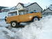 1966 Ford Bronco - This 1966 Ford Bronco is partially buried in a snowdrift on a residential street.