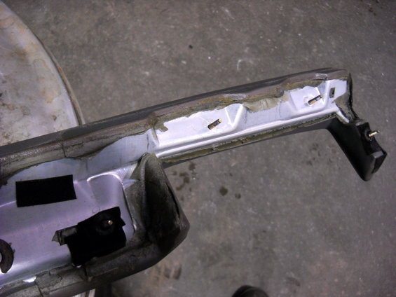 Interior trim piece with exposed mounting points and foam padding