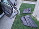 2003 Ford Taurus - Removed car door panels are laid out on the grass beside a tree.