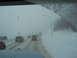 2009 Kenworth T800 - Driving through a blizzard on a highway with multiple vehicles on the road.