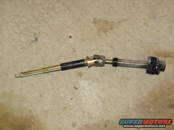 Steering shaft with universal joints and black rubber isolators