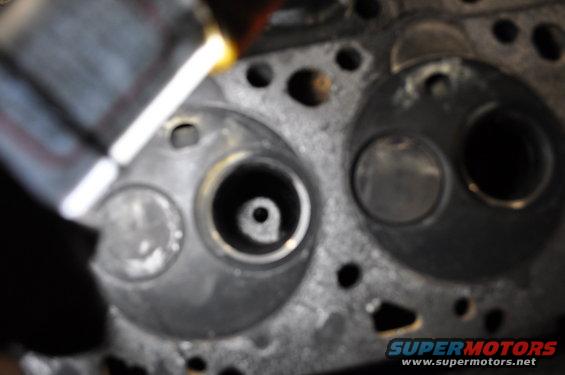 Close-up of an engine cylinder head with two valve openings