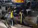 1992 Ford Bronco - The front axle assembly of a 1992 Ford Bronco is being worked on, supported by jack stands.