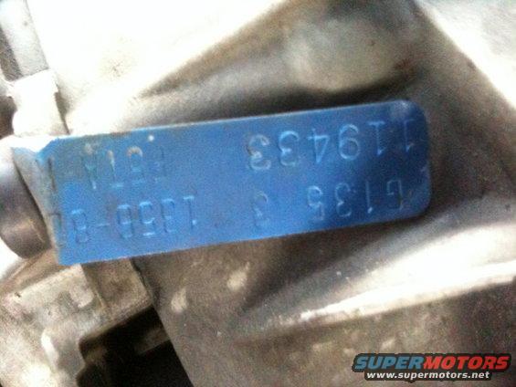 Blue metal tag with stamped numbers: G135 3 9519, 119433, 78-9581