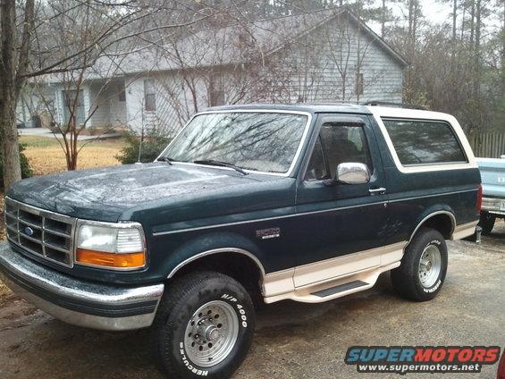 Dark green and tan 1993 Ford Bronco, 3/4 front view