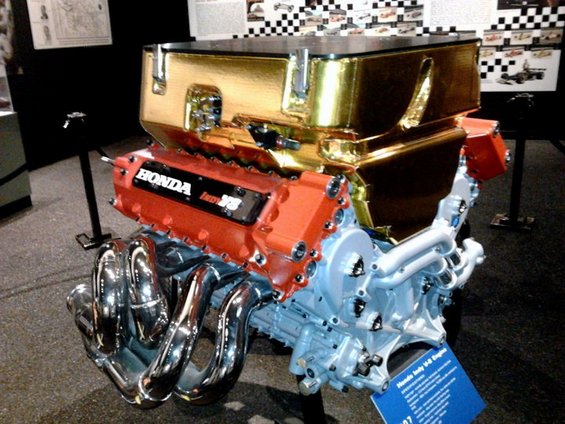 Honda Indy V8 engine with gold intake manifold and red valve covers