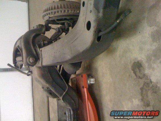 Close-up of a truck's front suspension assembly, possibly from a Ford F-150