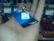 1986 Ford Ranger - A person holds an electrical connector part in their hand, with store shelves in the background.
