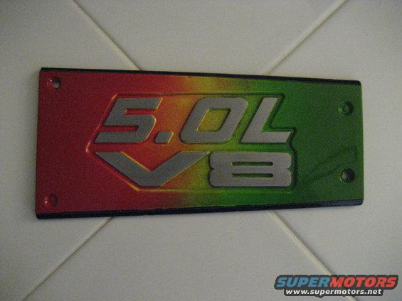 Red, yellow, and green 5.0L V8 emblem