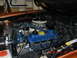 1973 Ford Bronco - Close-up view of the engine bay, blue valve covers and a chrome air cleaner assembly.