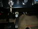 1973 Ford Bronco - Interior view of a vehicle showing the ignition, pedals, and floor mats.