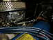 1973 Ford Bronco - Close-up view of an engine bay, showing the carburetor and air filter assembly.
