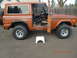 1973 Ford Bronco - This 1973 Ford Bronco is shown with its doors open, revealing the interior.