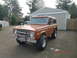 1973 Ford Bronco - This 1973 Ford Bronco is shown from a three-quarter front angle in front of a garage.