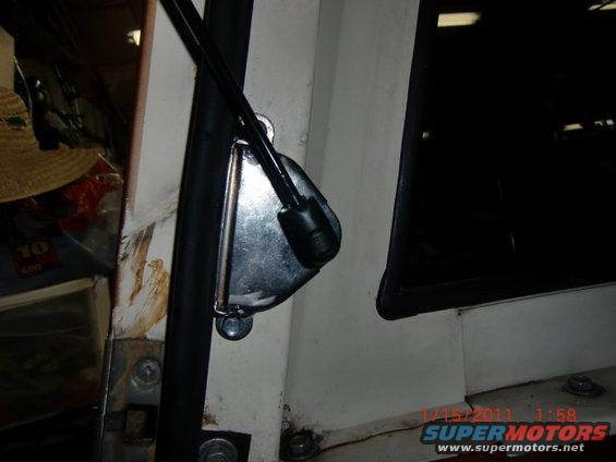 Close-up of a vehicle's interior door latch mechanism and frame