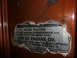 1973 Ford Bronco - A close-up view of a torn sticker detailing initial fill specifications for a 4-speed manual transmission and transfer case.