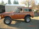 1973 Ford Bronco - This 1973 Ford Bronco features a lifted suspension and custom wheels, seen parked outdoors.