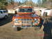 1973 Ford Bronco - Front view of a 1973 Ford Bronco, parked outdoors next to a white SUV.