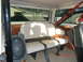 1973 Ford Bronco - Interior view of a 1973 Ford Bronco, rear seating and aftermarket audio equipment.