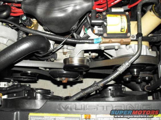 Engine bay with "MUSTANG" visible on radiator cover