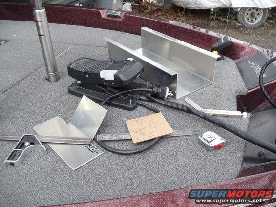 boat deck with foot pedal, aluminum brackets, ruler, and tape measure