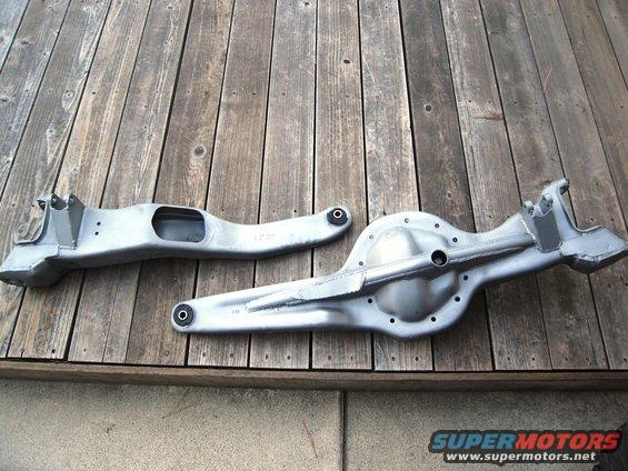 Front axle and differential housing parts on a wooden deck