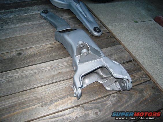 Silver suspension components on wooden planks