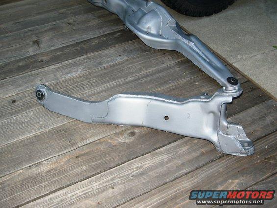 vehicle suspension arms on wooden planks