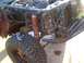 1992 Ford Ranger - The front end of a vehicle is disassembled, revealing its engine and suspension components.