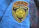 1995 Ford Crown Victoria - Patch for Melrose Auxiliary Police and Emergency Management on blue clothing.