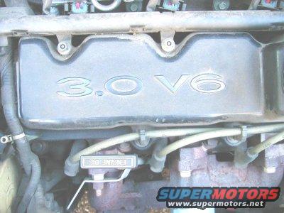 Engine valve cover showing '3.0 V6' and an 'ENGINE OIL' label