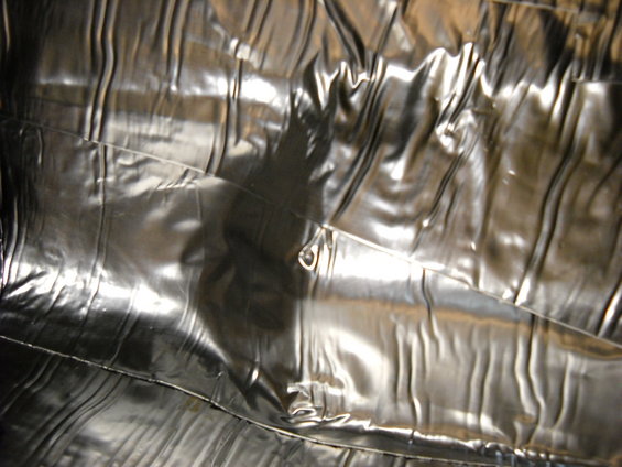 Close-up of crumpled metallic fabric interior lining