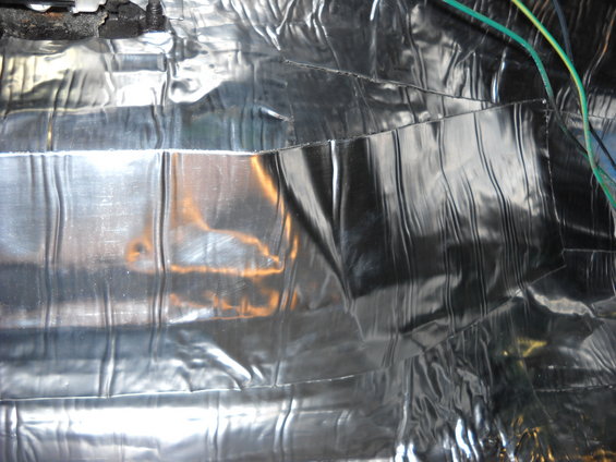 Sound deadening material and wires in a vehicle