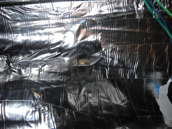Silver insulation material with visible tape and wires