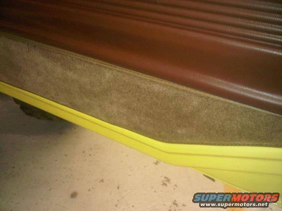 Brown interior door panel with yellow trim on a 1978 Ford Bronco