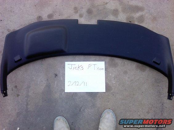 Black plastic automotive part with a handwritten note that says Jicks PT.com 2/12/11