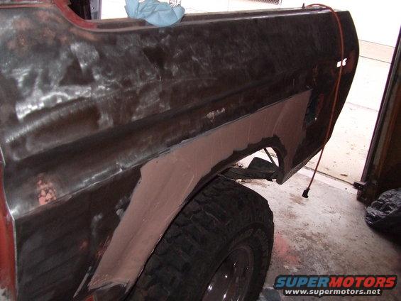 1979 Ford Bronco rear fender with body filler and exposed metal